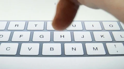 Man is typing on a tablet Stock Footage 79099791