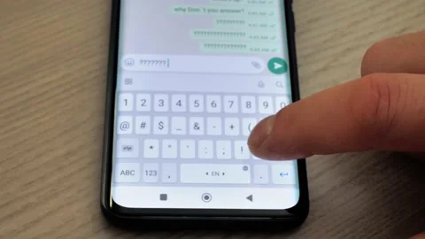 A man is typing a test message on a smartphone, close-up Stock Footage 229804669