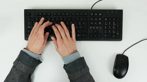 Man typing text on a keyboard on a white table. Top view Stock Footage 101839471