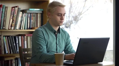 Man typing on text on laptop Stock Footage 84284677