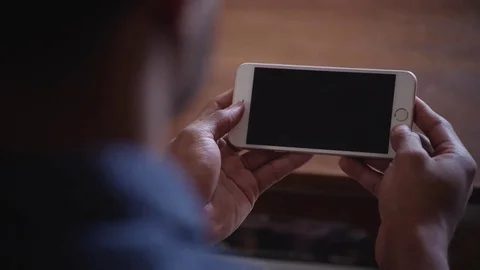 Man typing text message on mobile phone at home 스톡 동영상 83185136