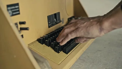 A man is typing text on an old electronic typewriter 스톡 동영상 169292916