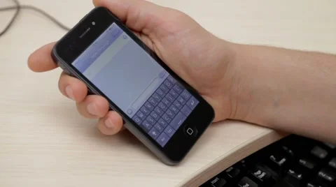A man is typing text on smartphone Stock Footage 54354602