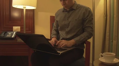 Man typing text using laptop in home interior. Stock Footage 74000021