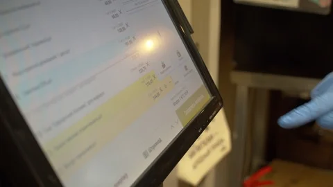 Man typing on touch screen of self checkout Stock Footage 128564462