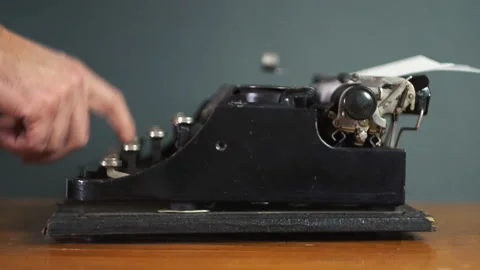 Man typing on a typewriter 4K Stock Footage 146484134