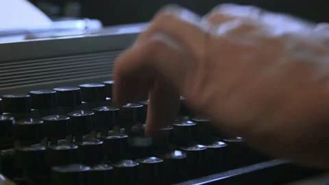 A man typing on a typewriter Stock Footage 170284294