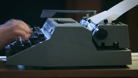 A man typing on a typewriter Stock Footage 175714953