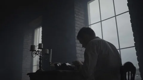 Man typing on a typewriter studio in loft studio Stock Footage 72634162