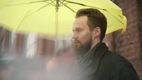 Man with umbrella Stock-Footage 129466173