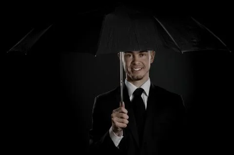 Man with umbrella Stock Photos
