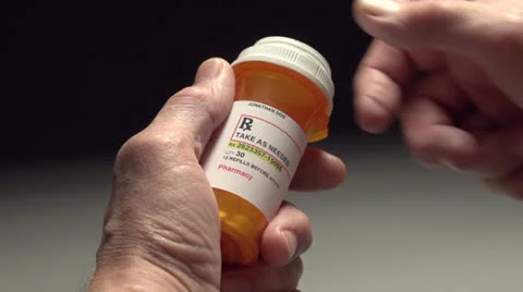 Man unable to open a pill bottle Stock Footage 24706275