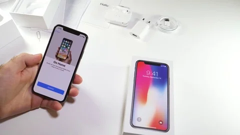 Man unbox the latest iPhone x activation of analytics data send time-lapse fast Stock Footage 82142265