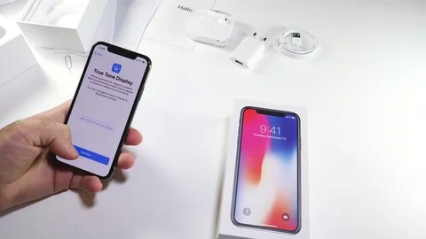 Man unbox the latest iPhone x activation true tone display 動画素材 82142707