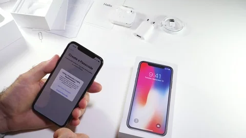Man unbox the latest iPhone x activation Stock Footage 82148102