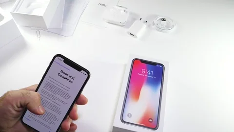 Man unbox the latest iPhone x activation terms and conditions Stock-Footage 82148670