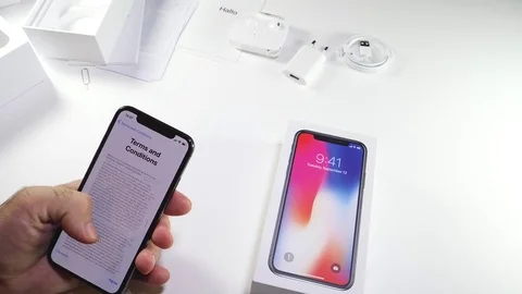 Man unbox the latest iPhone x activation terms and conditions Stock-Footage 82148762