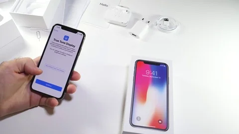 Man unbox the latest iPhone x accepting 動画素材 82148923