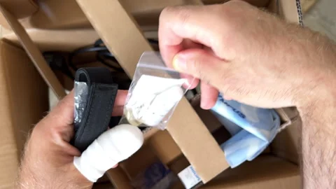 Man Unboxes Olympus Microscope in Box Stock Footage 306050773