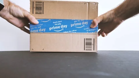 Man unboxing Amazon Prime Day cardboard parcel Stock Footage 95207968