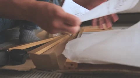Man unboxing and assembling flat pack furniture at home Stock Footage 329654934