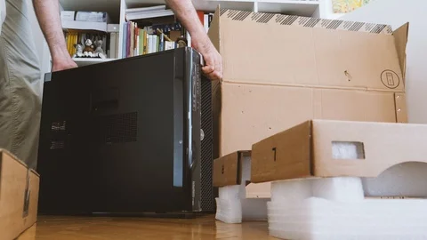 Man unboxing new Dell Computer Precision Workstation Stock Footage 90693013