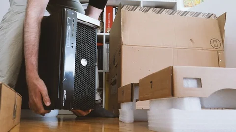 Man unboxing new Dell Computer Precision Workstation Stock Footage 90693014