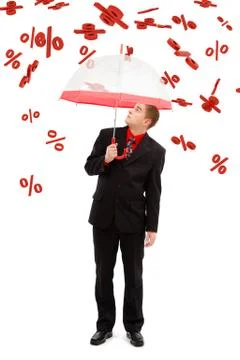 Man under falling percents Stock Photos