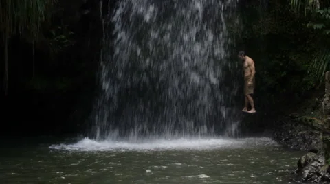 Man Under Waterfall Stock Footage 999147