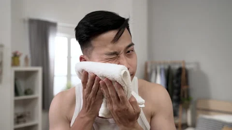 Man in undershirt is drying face Video stock 208079591