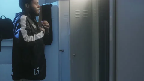 Man Undressing in Locker Room | Stock Video | Pond5