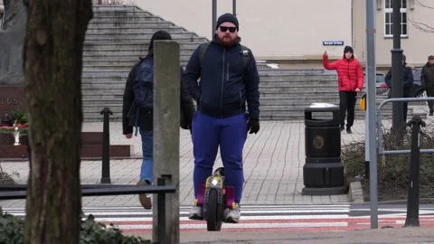 A man on a unicycle Stock Footage 236466804