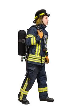 Man in uniform of firefighter posing in profile with air tank Stock Photos