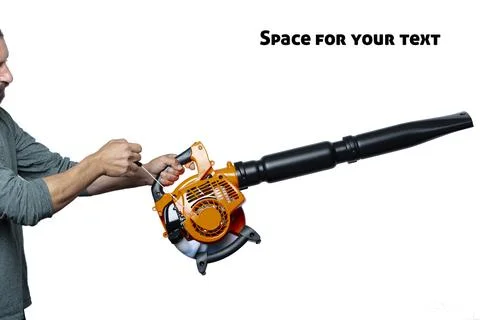 A man in uniform operating Engine pull cord a Air Blower Tool. Starting a han Stock Photos