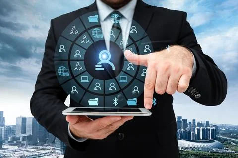 Man In Uniform Standing Holding Tablet And Virtually Tapping Screen. Busine.. Stock Photos