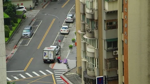 Man unloading crates from truck in Taipei Stock Footage