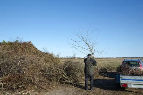 Man unloading a trailer Stock Photos