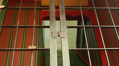 Man is unlocking cell jail door in the jail for the prisoners' freedom Stock Footage 49642787
