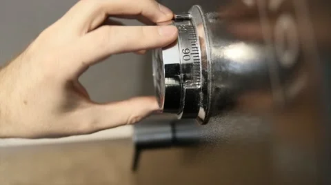 Man unlocking a home safe Stock Footage 47047063