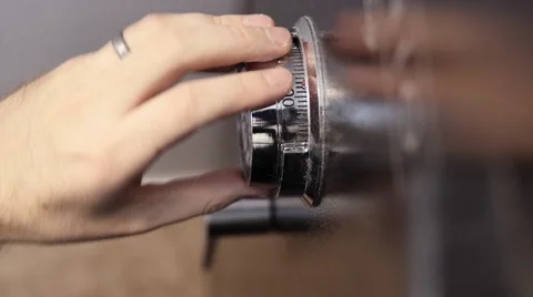 Man unlocking a home safe Stock Footage 47047191