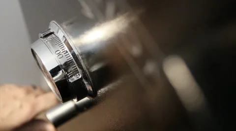 A man unlocking a home safe Stock Footage 47072370