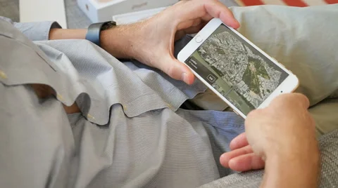 Man unlocking iPhone 7 apple maps flyover London United Kingdom Stock Footage 68451044