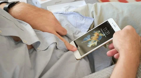 Man unlocking iPhone 7 settings Stock-Footage 68448498