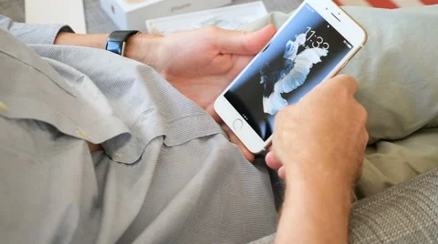 Man unlocking iPhone 7 settings Stock-Footage 68449364