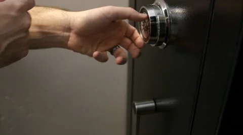 Man unlocking a safe Stock Footage 47085386