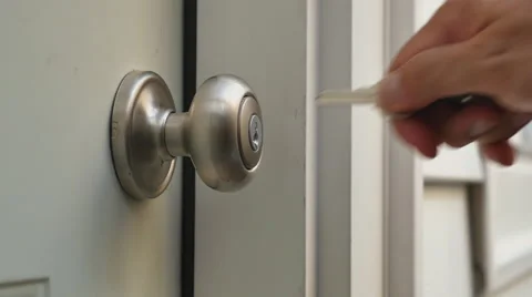 Man Unlocks Home Door and Enters Stock Footage