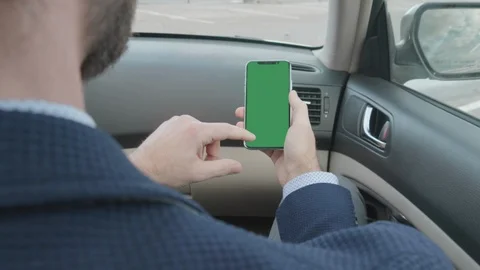Man Unlocks Mobile Smartphone, GPS Car Phone Navigation Green Chroma Mobile Cell Stock Footage 100301932