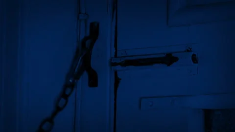 Man Unlocks Or Locks Door At Night With Latch 動画素材 248620315