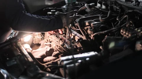 Man unmounting engine compensators at car service station Stock Footage 130576666