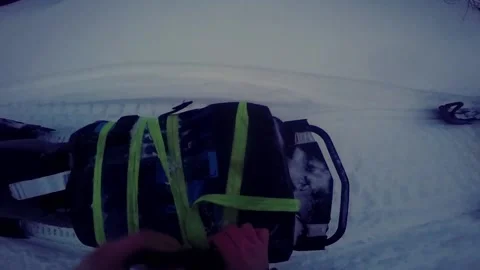 Man unpacking box on snowmobile 스톡 동영상 102161270